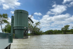 mounted feeder mounted above water level on dock