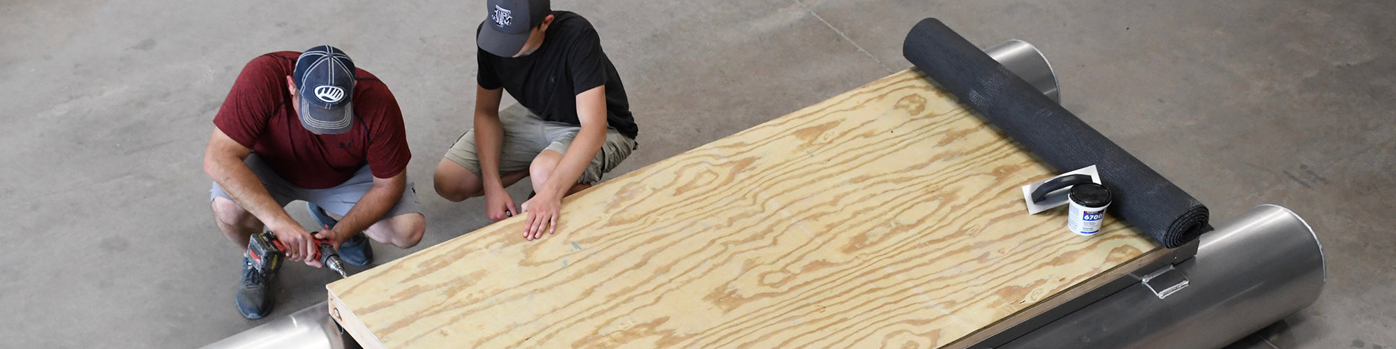 Dad and son building pontoon boat