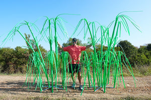 Man standing between two tower habitat products