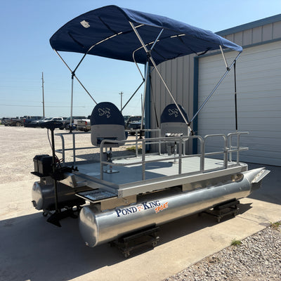 Providing shade for this small pontoon boat is the bimini top. 