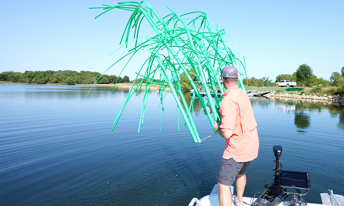 Tossing Tower habitat into pond