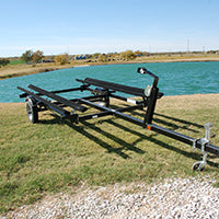 Boat trailer by pond