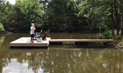 fishing with dog on floating dock